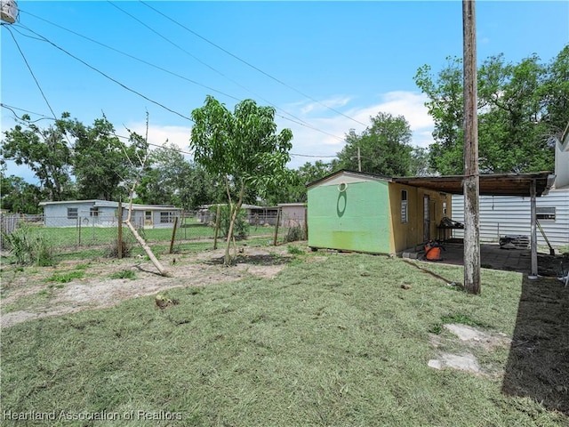 804 S 8th Ave, Wauchula, FL 33873 - view of yard with an outbuilding and fence