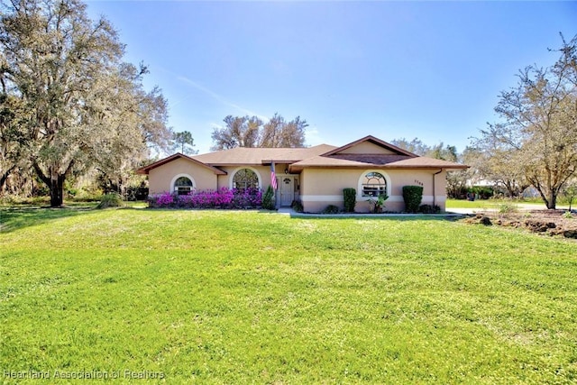 single story home with a front yard