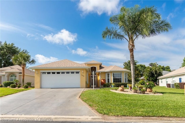 3108 Oakmont Dr, Avon Park, FL 33825 - view of front of property featuring driveway, a front lawn, a garage, and stucco siding
