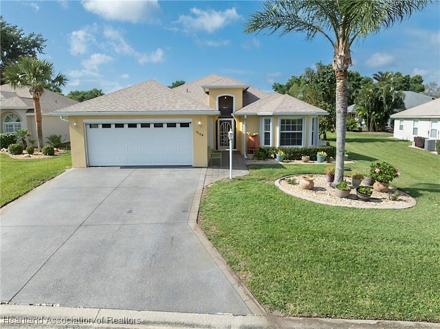 3108 Oakmont Dr, Avon Park, FL 33825 - ranch-style home with a garage, stucco siding, a front yard, a shingled roof, and driveway