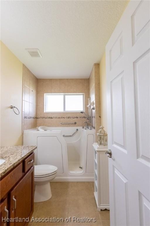 3108 Oakmont Dr, Avon Park, FL 33825 - full bath with visible vents, a bath, vanity, and tile patterned floors
