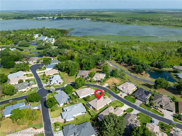 3108 Oakmont Dr, Avon Park, FL 33825 - drone / aerial view with a water view, a wooded view, and a residential view