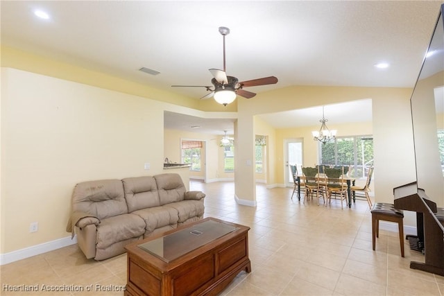 3108 Oakmont Dr, Avon Park, FL 33825 - living area with baseboards, light tile patterned floors, visible vents, lofted ceiling, and ceiling fan with notable chandelier