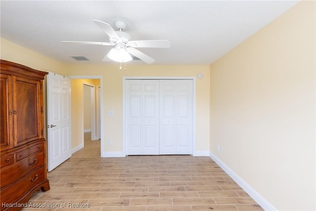 3108 Oakmont Dr, Avon Park, FL 33825 - unfurnished bedroom featuring visible vents, baseboards, a closet, and wood tiled floor