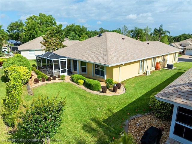 3108 Oakmont Dr, Avon Park, FL 33825 - rear view of property featuring a shingled roof, stucco siding, glass enclosure, and a lawn