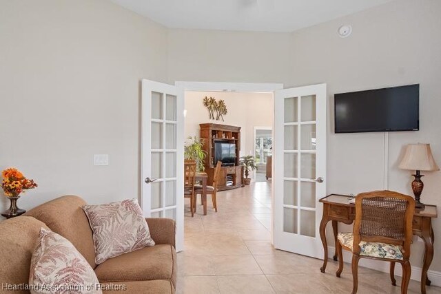 1624 Marble St, Sebring, FL 33870 - living area with french doors and light tile patterned floors