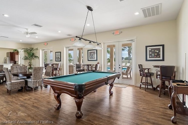 1624 Marble St, Sebring, FL 33870 - recreation room with french doors, healthy amount of natural light, wood finished floors, and recessed lighting