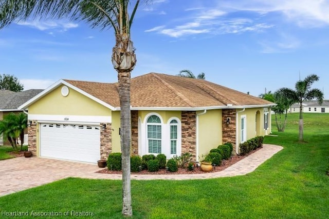 1624 Marble St, Sebring, FL 33870 - view of front of home with stucco siding, an attached garage, a front yard, decorative driveway, and stone siding