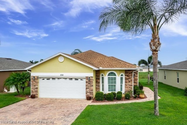1624 Marble St, Sebring, FL 33870 - ranch-style house featuring a front lawn, decorative driveway, stone siding, an attached garage, and stucco siding