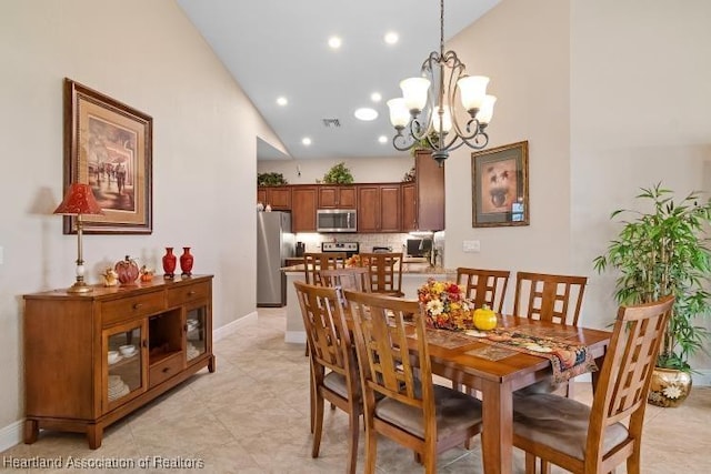 1624 Marble St, Sebring, FL 33870 - dining room with high vaulted ceiling, a chandelier, recessed lighting, and light tile patterned floors