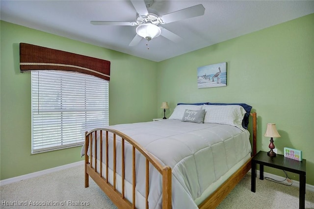 bedroom featuring carpet floors, a ceiling fan, and baseboards