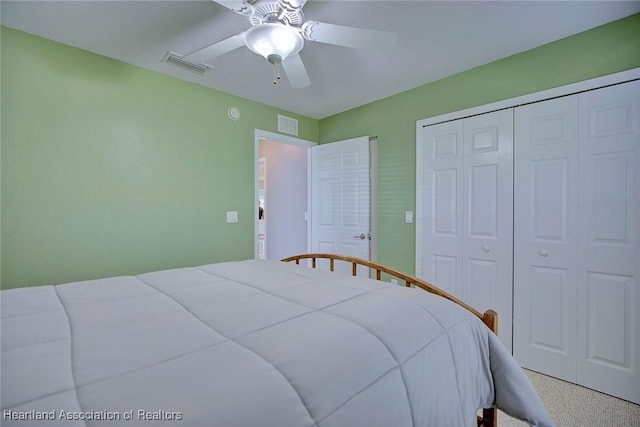 bedroom featuring ceiling fan, a closet, and visible vents