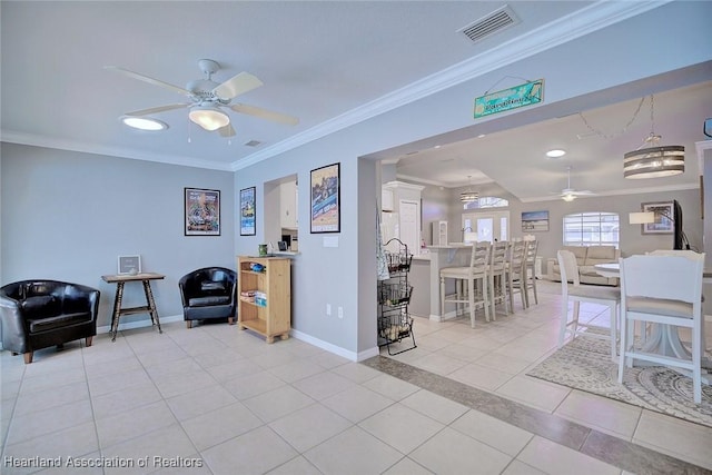 sitting room featuring light tile patterned floors, baseboards, visible vents, and crown molding