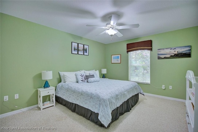 bedroom featuring carpet, baseboards, and a ceiling fan