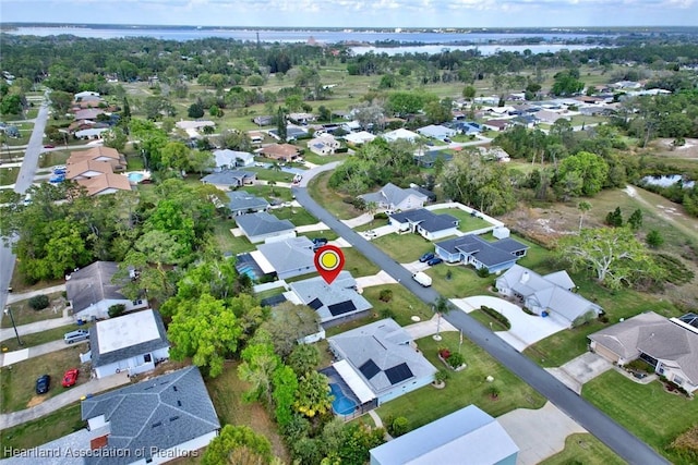 birds eye view of property with a residential view