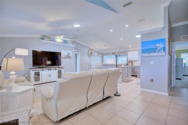 living area featuring vaulted ceiling, visible vents, crown molding, and light tile patterned floors