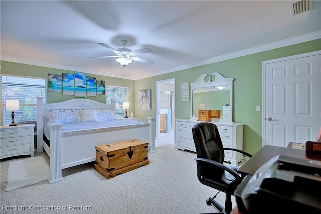 bedroom with ornamental molding, multiple windows, carpet, and visible vents