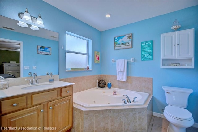 full bathroom featuring toilet, vanity, visible vents, a jetted tub, and tile patterned floors