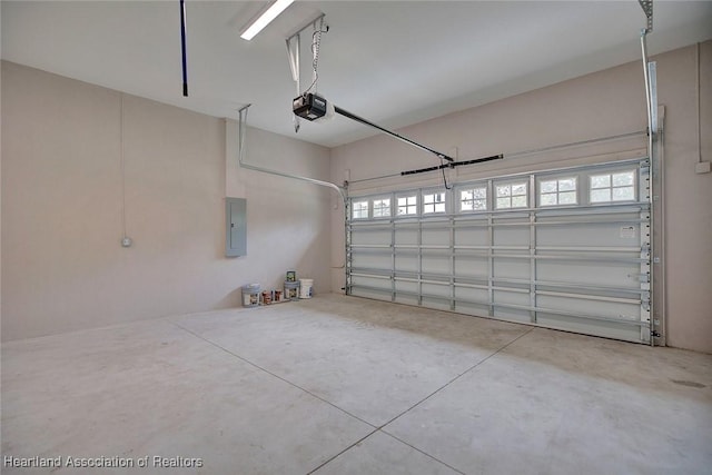 garage featuring electric panel and a garage door opener