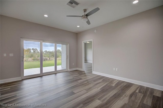 spare room featuring ceiling fan and hardwood / wood-style floors