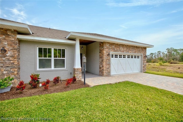 ranch-style home with a front yard and a garage