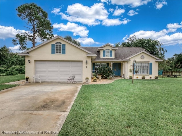 view of front of home featuring a front yard and a garage