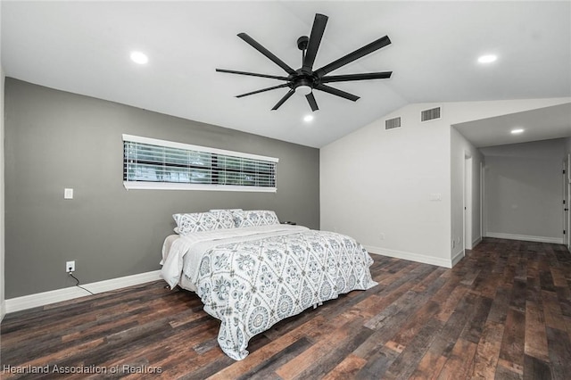 bedroom featuring lofted ceiling, visible vents, baseboards, and wood finished floors