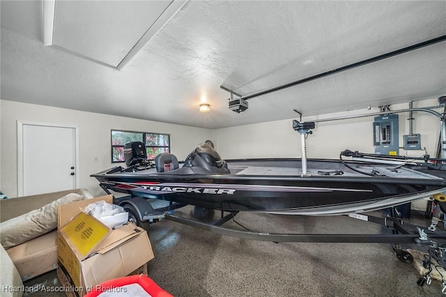 garage with electric panel and a garage door opener