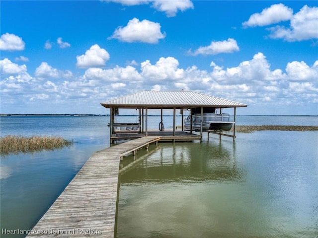 dock area featuring a water view and boat lift