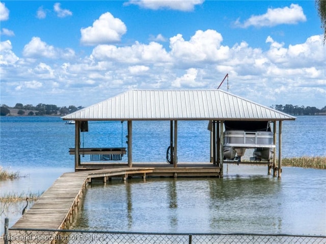 dock area featuring a water view and boat lift