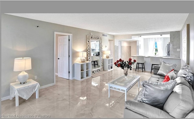 living room with a textured ceiling