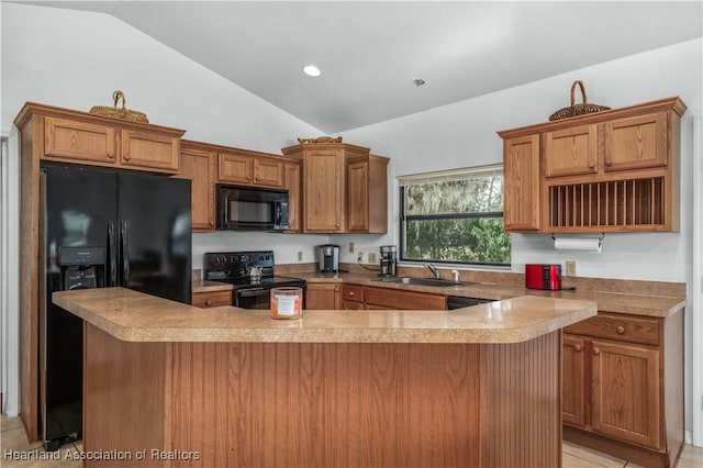 kitchen with light tile patterned floors, sink, vaulted ceiling, and black appliances