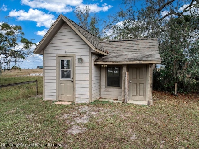 view of outdoor structure with a yard