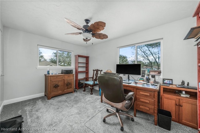 home office with light colored carpet and ceiling fan