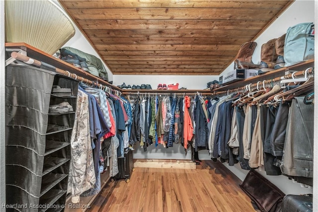 spacious closet featuring hardwood / wood-style flooring and lofted ceiling