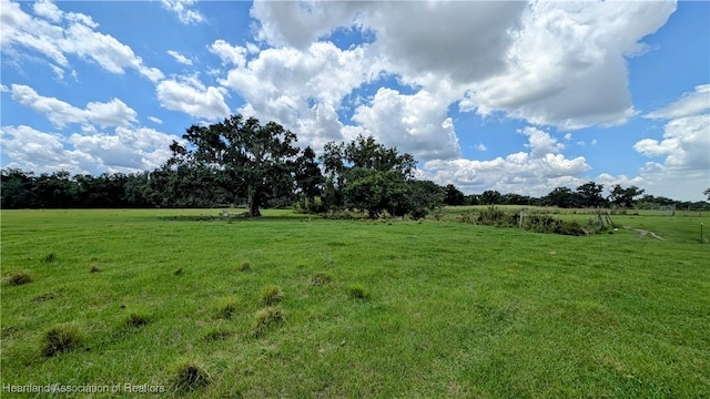 view of grassy yard with a view of countryside