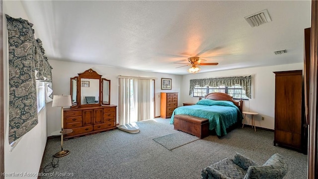 carpeted bedroom with a ceiling fan