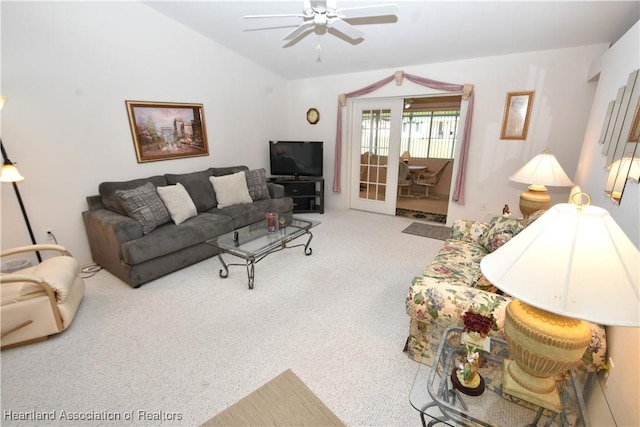 living room with carpet, french doors, ceiling fan, and lofted ceiling