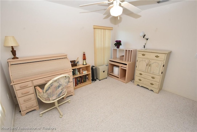 carpeted office with ceiling fan