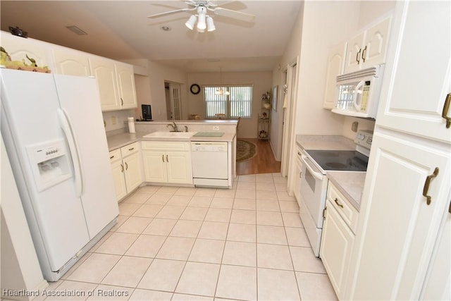 kitchen with white cabinetry, sink, kitchen peninsula, white appliances, and light tile patterned floors