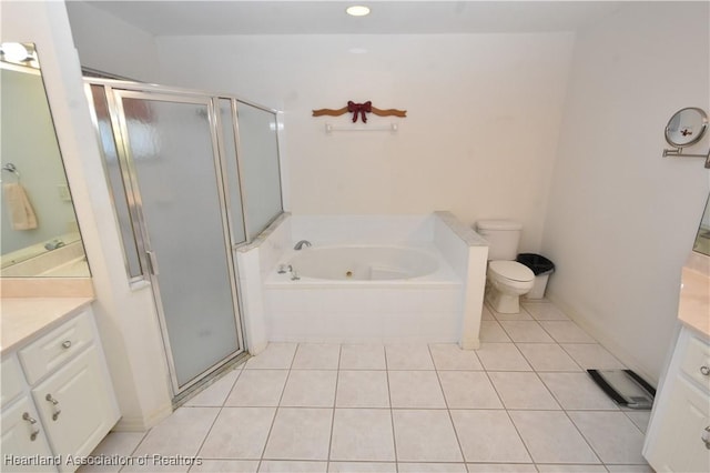 full bathroom with tile patterned flooring, vanity, separate shower and tub, and toilet