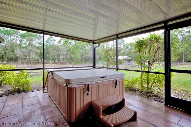 sunroom / solarium featuring a healthy amount of sunlight