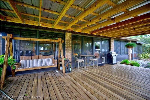 wooden terrace with area for grilling