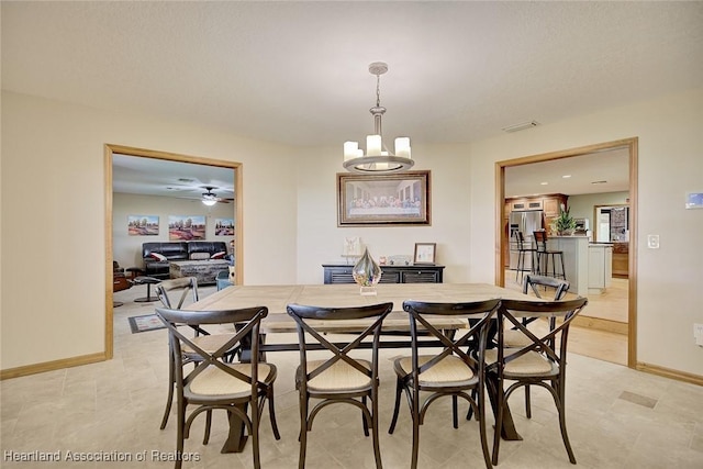 dining area featuring ceiling fan, visible vents, and baseboards