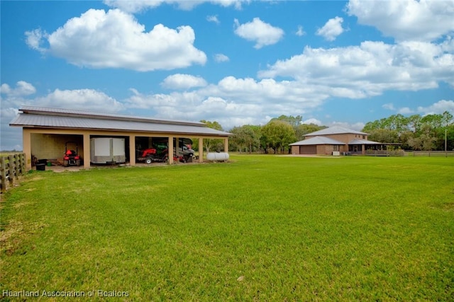 view of yard with a pole building