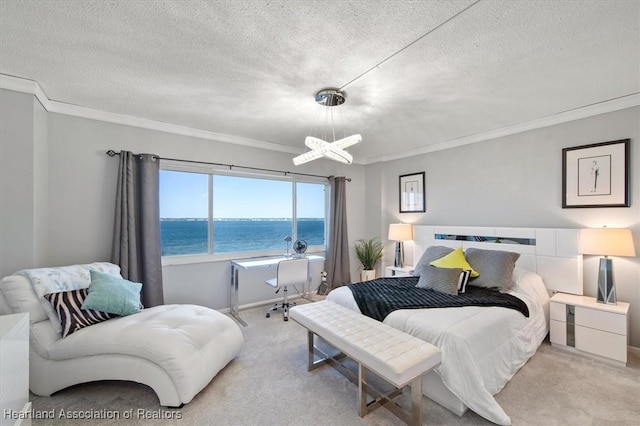 bedroom with ornamental molding, light carpet, a water view, and a textured ceiling