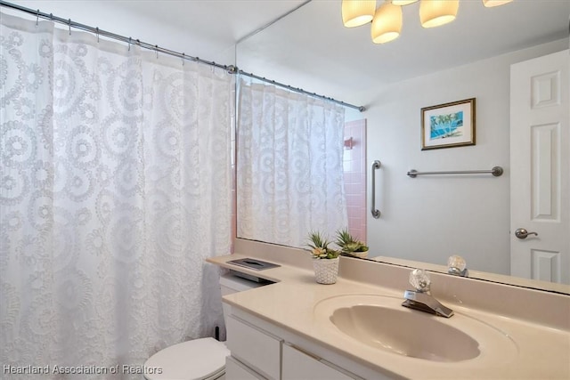 full bathroom with toilet, curtained shower, and vanity