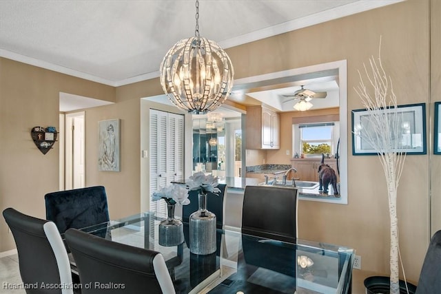 dining room featuring ornamental molding and ceiling fan with notable chandelier