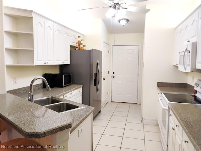 334 Sunshine Ave, Lake Placid, FL 33852 - kitchen featuring white appliances, ceiling fan, a peninsula, light tile patterned floors, and open shelves