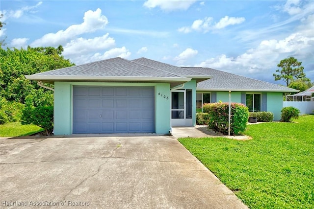 ranch-style home featuring roof with shingles, stucco siding, concrete driveway, an attached garage, and a front lawn